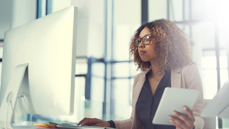 Woman working on a desktop computer